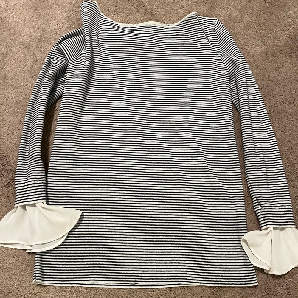Loft black and white striped sweater with cream ruffle sleeves.